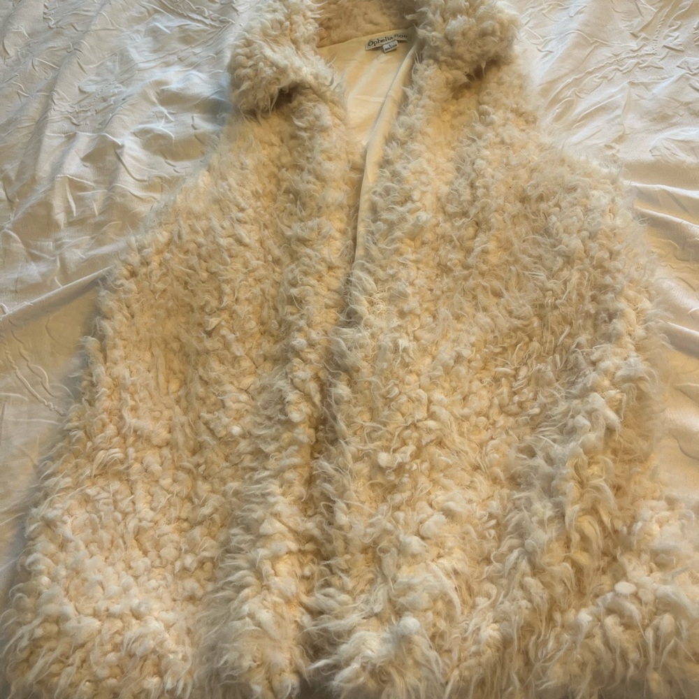 Cream colored fur vest